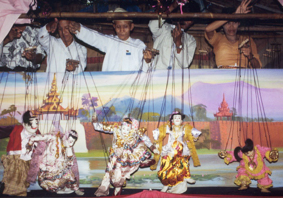 The puppeteers of  U Tun Kyi, Thaketa (Rangoon) perform the duet of the Prince and the Princess. Photograph by Elisabeth den Otter (C)